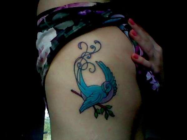 Side bird tattoo