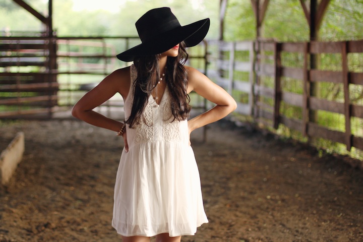 Floppy hat with white sleeveless mini dress