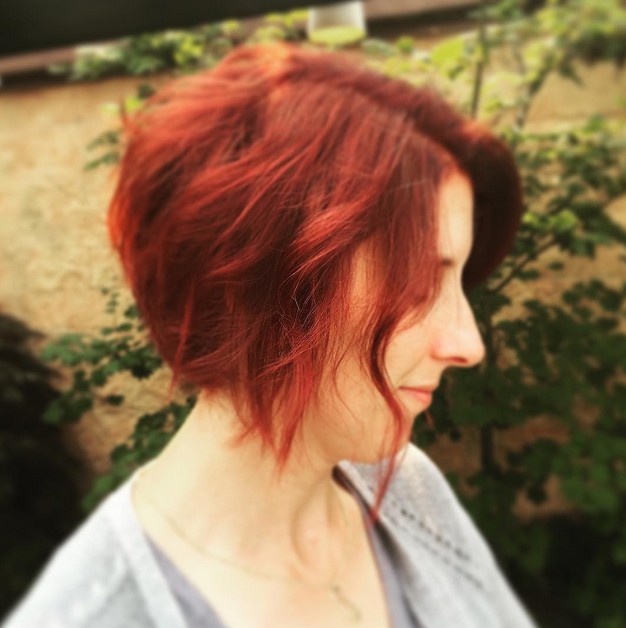 Redhead - short red messy curly angled bob hairstyle