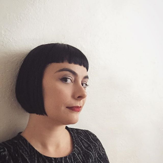 short dark blunt bob haircut with blunt bangs